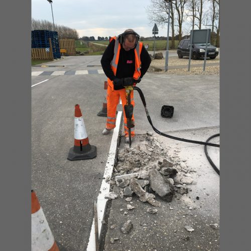 Workman Drilling for A Commercial Job