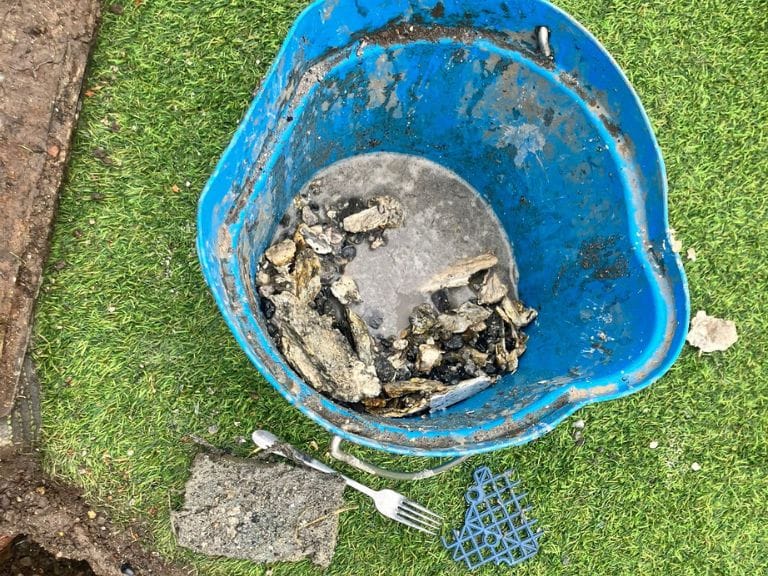 Bucket Filled with Drain Debris