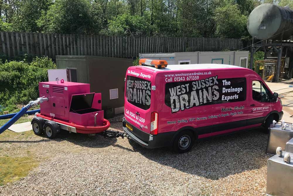West Sussex Drains pink van and drain unblocking equipment