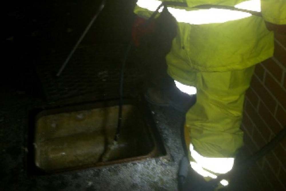 Emergency plumber at work at night